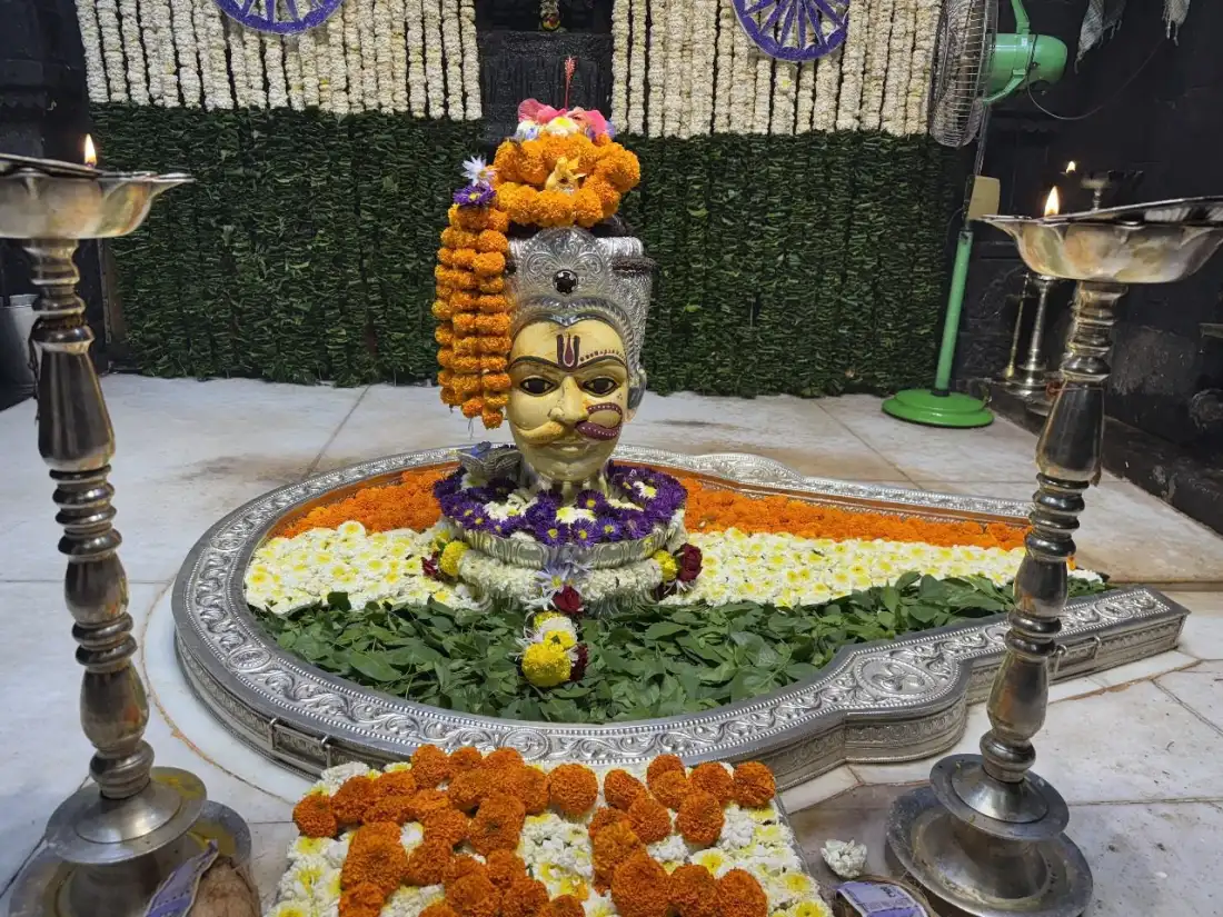 Shiva lingam decorated with marigolds at a Maharashtra Jyotirlinga