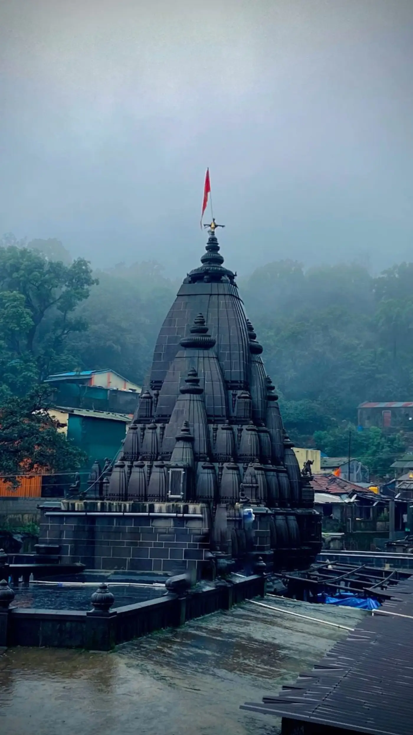 A Maharashtra temple spire wreathed in monsoon mist